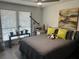 Serene bedroom with large window, gray bedding, a telescope, and minimalist decor creating a calming atmosphere at 1935 Conway Rd # T6, Orlando, FL 32812
