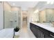 Luxurious bathroom with a soaking tub, glass-enclosed shower, double vanity, and elegant finishes for ultimate comfort at 1938 Spring Shower Cir, Kissimmee, FL 34744