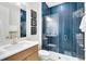Contemporary bathroom with a glass-enclosed shower and blue subway tile at 1938 Spring Shower Cir, Kissimmee, FL 34744