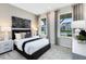 Comfortable bedroom with plush carpet, two large windows, and stylish decor at 1938 Spring Shower Cir, Kissimmee, FL 34744