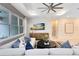 Inviting living room with large windows, comfortable seating, and a modern entertainment center for relaxation at 1938 Spring Shower Cir, Kissimmee, FL 34744