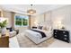 Serene main bedroom with natural light, stylish decor, and comfortable furnishings, creating a relaxing retreat at 1938 Spring Shower Cir, Kissimmee, FL 34744