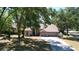 Aesthetic shot of a cozy single-story home featuring a three-car garage, lush lawn, and a welcoming environment at 2082 Nexus Ct, Apopka, FL 32712