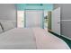 Cozy bedroom with white bedding, and views to the ensuite bathroom at 2082 Nexus Ct, Apopka, FL 32712