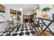 Bright breakfast nook with black and white tile flooring, a glass top table, and bar seating at 2082 Nexus Ct, Apopka, FL 32712