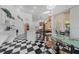 Open kitchen and breakfast nook with black and white checkerboard floor tiles at 2082 Nexus Ct, Apopka, FL 32712