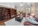Comfortable living room features a vaulted ceiling and a neutral palette with wood floors at 2082 Nexus Ct, Apopka, FL 32712