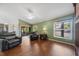 Bright and airy living room with wood flooring and comfortable seating at 2082 Nexus Ct, Apopka, FL 32712