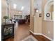 Bright, open-concept living room showcasing hardwood floors, natural light, and stylish furnishings at 2082 Nexus Ct, Apopka, FL 32712
