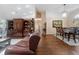 Spacious living and dining room showcasing hardwood floors, natural light, and stylish furnishings at 2082 Nexus Ct, Apopka, FL 32712
