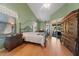 Charming main bedroom with hardwood floors, large windows, and elegant furnishings and canopy bed at 2082 Nexus Ct, Apopka, FL 32712