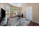 Sunlit office featuring arched windows, ceiling fan, modern workstation, and stylish decor at 2082 Nexus Ct, Apopka, FL 32712