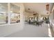 Covered outdoor patio featuring comfortable wicker furniture and a ceiling fan at 2082 Nexus Ct, Apopka, FL 32712