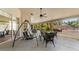 Relaxing outdoor patio featuring a swing, comfortable seating, and a ceiling fan at 2082 Nexus Ct, Apopka, FL 32712