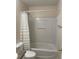 Bathroom featuring a standard white shower-tub combo with white shower curtain at 2164 Black Mangrove Dr, Orlando, FL 32828