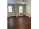 Bright, spacious bedroom features wood-look flooring and a ceiling fan for added comfort at 2164 Black Mangrove Dr, Orlando, FL 32828