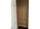 Bright closet with sturdy, white wire shelving and wood-look flooring offers ample storage space at 2164 Black Mangrove Dr, Orlando, FL 32828