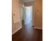 Hallway with wood-look flooring offers access to various rooms within the home at 2164 Black Mangrove Dr, Orlando, FL 32828