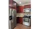 Kitchen featuring stainless steel appliances including a refrigerator, stove, oven, and microwave at 2164 Black Mangrove Dr, Orlando, FL 32828