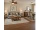 Inviting living room with a neutral color palette, wood floors, and ceiling fan at 2164 Black Mangrove Dr, Orlando, FL 32828