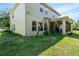 Exterior view of home featuring a swing set, screened lanai and well-maintained lawn at 2401 Home Again Rd, Apopka, FL 32712