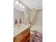 Well-lit bathroom featuring a wood vanity, framed mirror, and shower-tub combination at 2401 Home Again Rd, Apopka, FL 32712