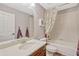 Bathroom features a tub and shower combo, vanity, large mirror, and private toilet area at 2401 Home Again Rd, Apopka, FL 32712