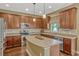 Well-equipped kitchen with a center island, stainless steel appliances, and plenty of cabinet space for storage at 2401 Home Again Rd, Apopka, FL 32712