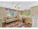 Relaxing upstairs loft with neutral paint, soft lighting and a comfortable seating area at 2401 Home Again Rd, Apopka, FL 32712