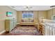Upstairs loft featuring a comfortable sofa, desk, and plenty of natural light at 2401 Home Again Rd, Apopka, FL 32712