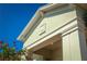 Close-up of the home's architectural detailing, highlighting the trim and the decorative emblem at 2458 Dream Home Ct, St Cloud, FL 34772