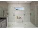 Modern bathroom featuring dual shower, marble-tiled walls, and a bright, open design at 2458 Dream Home Ct, St Cloud, FL 34772