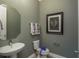 Elegant powder room with modern fixtures, soft lighting, and sophisticated decor at 2458 Dream Home Ct, St Cloud, FL 34772