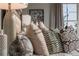 Stylishly designed bedroom features decorative pillows and an abundance of natural light at 2458 Dream Home Ct, St Cloud, FL 34772