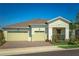 Attractive single-Gathering home showcasing a well-maintained lawn, paved driveway, and a welcoming facade at 2458 Dream Home Ct, St Cloud, FL 34772