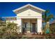 Quaint front porch showcases a rocking chair and decorative shrubbery creating a cozy and welcoming entry at 2458 Dream Home Ct, St Cloud, FL 34772