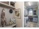 Welcoming mudroom featuring storage, bench, and adjacent laundry area for convenience at 2458 Dream Home Ct, St Cloud, FL 34772