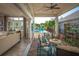 Inviting outdoor patio with comfortable seating overlooking a luxurious pool area at 2458 Dream Home Ct, St Cloud, FL 34772