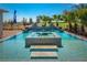 Stunning pool with a built-in spa and decorative fountains set against a blue sky at 2458 Dream Home Ct, St Cloud, FL 34772