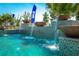 Elegant outdoor pool with tiered mosaic tile water features and a glimpse of neighborhood at 2458 Dream Home Ct, St Cloud, FL 34772