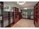 Spacious walk-in closet features custom shelving and ample storage, perfect for organizing clothing and accessories at 2458 Dream Home Ct, St Cloud, FL 34772