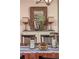 Inviting dining room with an ornate mirror, decorative lamps, and candles on a stylish wooden table at 2460 Dream Home Ct, St Cloud, FL 34772