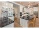 Bright and modern kitchen with a large island, pendant lighting, white cabinetry and stainless steel appliances at 2460 Dream Home Ct, St Cloud, FL 34772