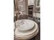 The kitchen island features black countertops, decorative dishes, and stainless steel appliances in the background at 2460 Dream Home Ct, St Cloud, FL 34772