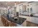Modern, expansive kitchen with a large island, pendant lighting, and stainless steel appliances at 2460 Dream Home Ct, St Cloud, FL 34772