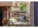 Inviting outdoor kitchen and dining area with a built-in grill and comfortable seating for entertaining at 2460 Dream Home Ct, St Cloud, FL 34772