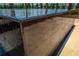 Edge of a sleek, dark-stone water feature with cascading water at 2460 Dream Home Ct, St Cloud, FL 34772