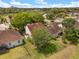 This is an aerial view of several single-Gathering homes featuring manicured lawns, mature trees and tile roofs in a suburban neighborhood at 2565 Albion Ave # 2, Orlando, FL 32833