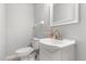 Bright bathroom featuring a modern sink and toilet with a neutral color scheme at 2565 Albion Ave # 2, Orlando, FL 32833