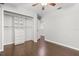 Bedroom featuring hardwood floors, closet and a ceiling fan at 2565 Albion Ave # 2, Orlando, FL 32833